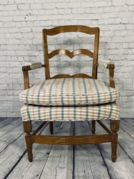 Antique Upholstered Chair With Plaid Pattern And Ornate Carved Detail