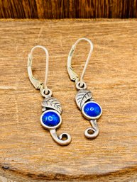 Silver Dangle Earrings With Leaf Motif And Blue Gemstones