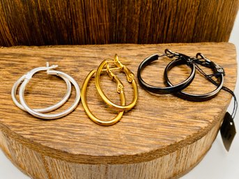3 Pair Of Sterling Silver Hoop Earrings: One Black, One Silver And One Gold Plated, All 925
