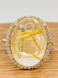 8.93ct Oval Cabochon Golden Rutilated Quartz With .32ctw Round White Zircon 10k Gold Ring - Size 6