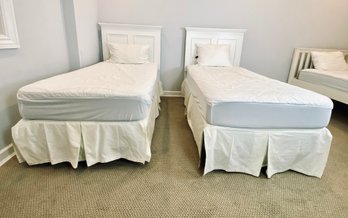 Pair Of Twin Beds With White Headboards