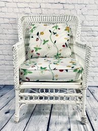 Painted White Wicker Arm Chair With Floral Print Cushion And Pillow