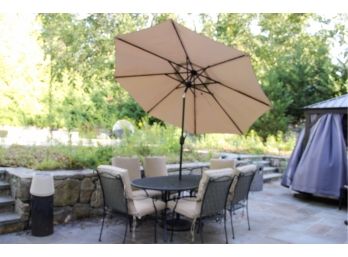 Oval Iron Patio Table With 6 Iron Chairs And Umbrella In Stand