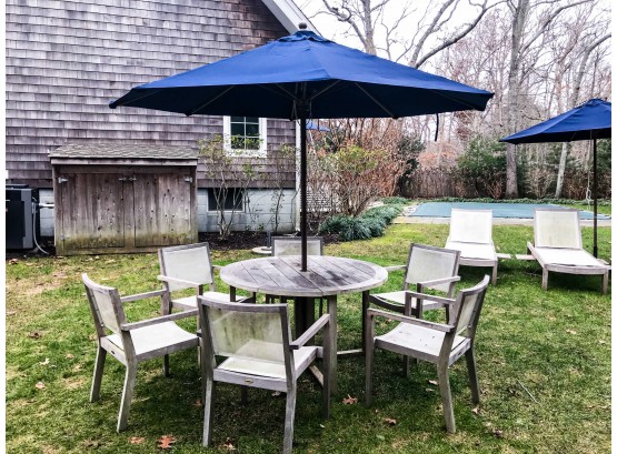Round Regatta Teak Dining Table With 6 Regatta Grey Wash Chairs With White Mesh Seats And Round Navy Umbrella