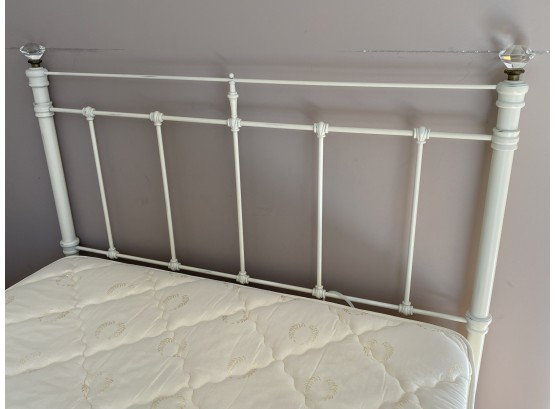 Cream Painted Iron Full Sized Bed With Clear Gems On Each Side Of The Headboard