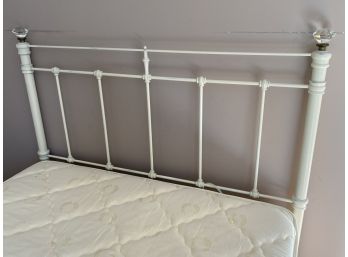 Cream Painted Iron Full Sized Bed With Clear Gems On Each Side Of The Headboard