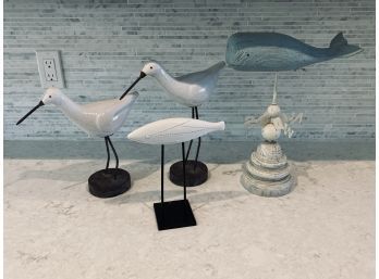 Collection Of White Ceramic Fish And Birds On Stands
