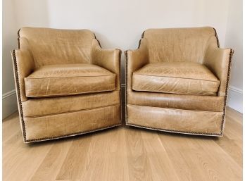 Pair Of Tan Leather Master Swivel Barrel Chairs With Nailhead Detail And Pony Hair Backs