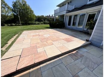 Large Stone Patio - Beige Flagstone Pavers Set In Concrete Which Has Separated