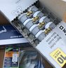 Box Of New Unused Electrical Items And A Used Respirator