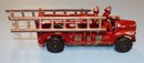 Two Toy Firetrucks - Ertl Seagrave And Cast Aluminum Ladder Truck With Ladders
