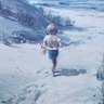 Vintage Framed Print Of Boy Walking On Sand Dunes