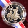 Two Olympic Proof Coins - One 1983-S Silver Dollar And One 1995-s Clad Half Dollar
