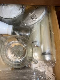 Drawer With Vacuum Packing FoodSaver Machine & Bags, Glass Juicer, Clear Plates, Nut Grinder, And More