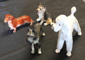 Four Porcelain Dogs - Various Sizes