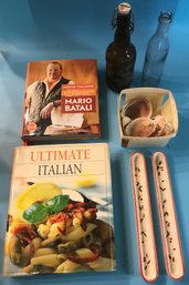 2 Hard Cover Italian Cook Books, 2 Ceramic Olive Trays, Basket Of Sea Shells And 2 Vintage Bottles