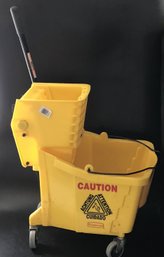Rubbermaid Commercial Yellow Plastic Mop Bucket Set On Wheels