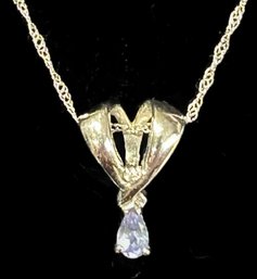 14Kt White Gold,  Pear Shaped Tanzanite & Diamond Chip Pendant On 17' White 14K Gold Chain,  Weight1.20 Dwt