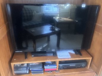SANYO (40' Diagonal) Flat Screen TV And Sharp VCR Player & LG DVD Player And Group Of Various DVDs