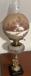 Antique Electrified Fluid Lamp With Cherub Base & Glass Font And Hand Painted Globe With Winter Scene