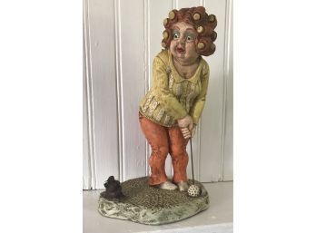 Comical Statue Of Woman Putting