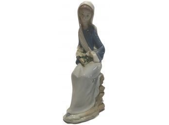 Lladro Retired Figurine Of GIrl With Lilies