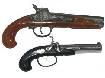 Two Similar Toy Flintlock Pistols