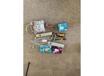 Lot Of Power Strips, Bulbs And Bbq Lighter