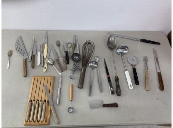 Lot Of Kitchen Utensils With Quite A Few Knives