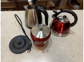 Two Tea Kettles One Electric And One Red Kitchen Cannister