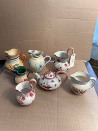 Estate Group Seven Mostly Italian Faence Pitchers, One Teapot